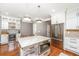 Open concept kitchen featuring stainless steel appliances, pendant lighting, and a large kitchen island at 136 Fair Sailing Rd, Mount Pleasant, SC 29466