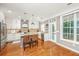 Open-concept kitchen with a large island, modern lighting, white cabinets and stainless steel appliances at 136 Fair Sailing Rd, Mount Pleasant, SC 29466