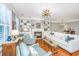Well-lit living room with hardwood floors, fireplace, built-ins, and view to breakfast area at 136 Fair Sailing Rd, Mount Pleasant, SC 29466