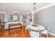 Open floor plan showcasing wood floors, large windows, and living room at 136 Fair Sailing Rd, Mount Pleasant, SC 29466