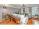 Bright living room featuring hardwood floors, two chairs, and an open staircase and view to second level at 136 Fair Sailing Rd, Mount Pleasant, SC 29466