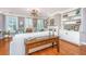 Spacious living room and dining room featuring built-in shelving, wood floors, and lots of natural light at 136 Fair Sailing Rd, Mount Pleasant, SC 29466