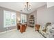 Cozy home office with a vintage desk, a decorative chair, and bright natural light at 136 Fair Sailing Rd, Mount Pleasant, SC 29466