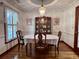 Formal dining room featuring a classic chandelier, wood floors, and traditional furnishings for elegant dining at 14 Ashland Dr, Charleston, SC 29407