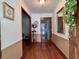 Welcoming foyer with hardwood floors, decorative accents, and traditional wainscoting, providing a warm entry at 14 Ashland Dr, Charleston, SC 29407