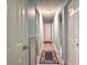 Hallway with hardwood floors, neutral walls, and a functional layout for easy access to rooms at 14 Ashland Dr, Charleston, SC 29407