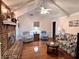 Cozy living room with vaulted ceilings, a brick fireplace, and comfortable seating for relaxation at 14 Ashland Dr, Charleston, SC 29407