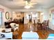 Open living space with hardwood floors seamlessly connecting the living, dining, and kitchen areas at 14 Ashland Dr, Charleston, SC 29407