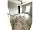 Bedroom with wood-look flooring, a ceiling fan, and a window at 144 Craft Ln, Round O, SC 29474