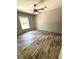 Bedroom with wood-look flooring, a ceiling fan, and a window at 144 Craft Ln, Round O, SC 29474