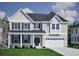 Charming two-story home with a well-manicured lawn and attached garage at 147 Seaton St, Summerville, SC 29486