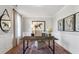 Charming home office features a rustic desk, natural light, and horse art at 147 Seaton St, Summerville, SC 29486