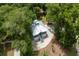 A beautiful aerial view showcases the home nestled among mature trees at 16 Oakwood Ln, Edisto Island, SC 29438