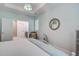Main bedroom featuring a bed, chair, and doorway to the bathroom at 16 Oakwood Ln, Edisto Island, SC 29438