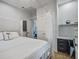 Well-lit bedroom with a canopy bed, complemented by a desk and stylish decor at 16 Oakwood Ln, Edisto Island, SC 29438