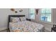 Inviting bedroom with nautical decor, complemented by natural light streaming through the windows at 16 Oakwood Ln, Edisto Island, SC 29438