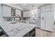 Well-appointed kitchen featuring a large quartz island, stainless appliances, and ample storage at 16 Oakwood Ln, Edisto Island, SC 29438