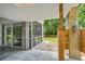 A well maintained area underneath the house with an outdoor shower and screen porch at 16 Oakwood Ln, Edisto Island, SC 29438