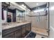 Modern bathroom features a glass shower, granite counters, and a dark wood vanity with double sinks at 165 Village Ponds Dr, Summerville, SC 29483
