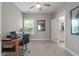 Cozy bedroom or office space with a ceiling fan, natural light, and neutral carpet floors at 165 Village Ponds Dr, Summerville, SC 29483