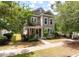 A cozy two-story house with neat landscaping and a welcoming front porch, offering a glimpse of suburban charm at 165 Village Ponds Dr, Summerville, SC 29483