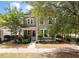 Charming two-story home featuring a quaint front porch, complemented by lush landscaping and inviting curb appeal at 165 Village Ponds Dr, Summerville, SC 29483