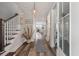 Entryway showcasing hardwood floors, a staircase, and a view through to the bright and open living spaces at 165 Village Ponds Dr, Summerville, SC 29483