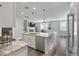 Open kitchen showcases marble island, stainless steel appliances, and seamless flow to living space at 165 Village Ponds Dr, Summerville, SC 29483