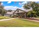 Community pavilion with picnic tables, stone pillars, a lush lawn, and landscaping at 165 Village Ponds Dr, Summerville, SC 29483
