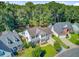 An aerial view captures the house, its two-car garage, and its neighboring houses along the street at 180 Willowbend Ln, Summerville, SC 29485