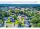 An aerial view highlights houses interspersed with trees and landscaping within a neighborhood at 180 Willowbend Ln, Summerville, SC 29485