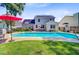 Serene backyard features a refreshing pool, patio furniture, and green lawn, perfect for outdoor living at 180 Willowbend Ln, Summerville, SC 29485