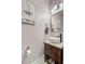 Charming half-bathroom with a round vessel sink and wood cabinet at 180 Willowbend Ln, Summerville, SC 29485