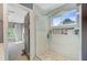 Beautiful bathroom featuring a tiled shower, a window, and decorative accents at 180 Willowbend Ln, Summerville, SC 29485