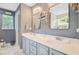 Bathroom features double sinks, two mirrors, white countertops, and blue walls at 180 Willowbend Ln, Summerville, SC 29485