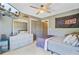 Comfortable bedroom featuring a bed, dresser, ceiling fan, and decorative wall art at 180 Willowbend Ln, Summerville, SC 29485