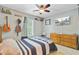 Comfortable bedroom featuring a bed, dresser, TV, and decorative accents at 180 Willowbend Ln, Summerville, SC 29485