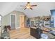 Spacious bonus room featuring wood flooring, a ceiling fan, and built-in shelving, perfect for flexible living at 180 Willowbend Ln, Summerville, SC 29485