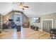 Bonus room with a window, comfortable chair, ceiling fan, and wood flooring, offering a versatile space at 180 Willowbend Ln, Summerville, SC 29485