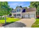 Charming two-story home boasts a manicured lawn, a two-car garage, and beautiful landscaping at 180 Willowbend Ln, Summerville, SC 29485