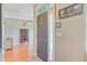 Bright foyer featuring hardwood floors, a modern light fixture, and a view into the adjacent living spaces at 180 Willowbend Ln, Summerville, SC 29485