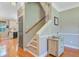 Foyer hallway with staircase leading upstairs with view into the kitchen at 180 Willowbend Ln, Summerville, SC 29485
