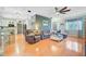 Open-concept living area with hardwood floors, neutral tones, and an adjacent kitchen and dining space at 180 Willowbend Ln, Summerville, SC 29485