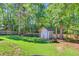 Charming shed in a spacious backyard with trees, providing ample storage and enhancing outdoor appeal at 180 Willowbend Ln, Summerville, SC 29485