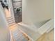 Hallway staircase with hardwood floors, gray runners, and white trim at 180 Willowbend Ln, Summerville, SC 29485