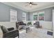 Cozy sunroom features neutral gray decor and tile floors, perfect for relaxing at 180 Willowbend Ln, Summerville, SC 29485
