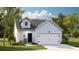 Charming single-story home with light blue siding, a single-car garage, and a cozy front porch at 187 Norse Bay, Summerville, SC 29486