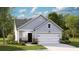 Charming one-story home with light blue siding, stone accents, and a two-car garage in a well-maintained community at 189 Norse Bay, Summerville, SC 29486