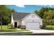 Inviting home exterior with a two-car garage, stone accents, and well-maintained landscaping at 190 Norse Bay, Summerville, SC 29486