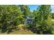 A stunning aerial view of a well-placed home nestled among lush trees and pond views at 1971 N North Creek Dr, Mount Pleasant, SC 29466